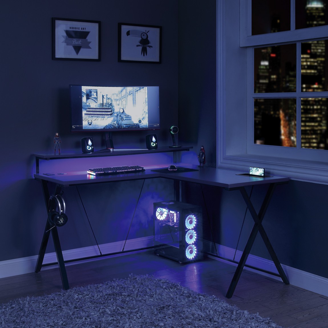 Blue LED gaming setup with l shaped gaming desk for gaming sessions
