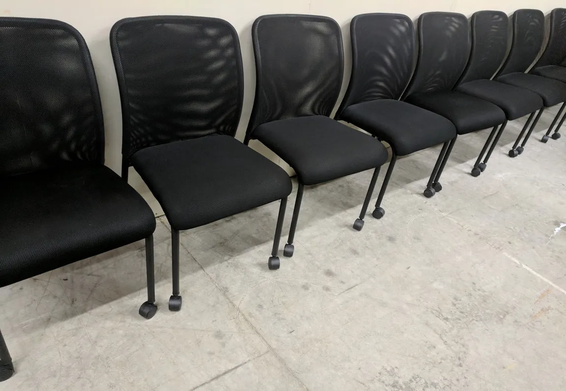 Offices To Go Black Rolling Guest Chairs