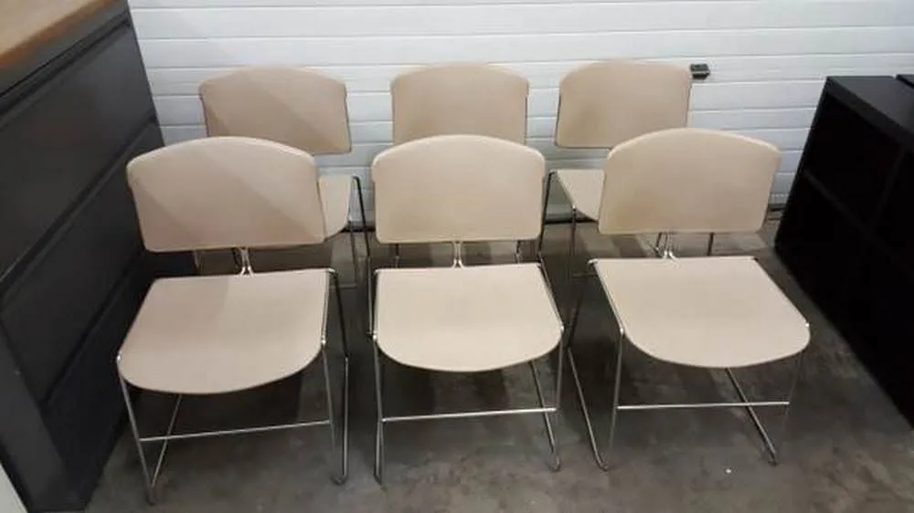 Used Tan Plastic and Metal Stacking Chairs 